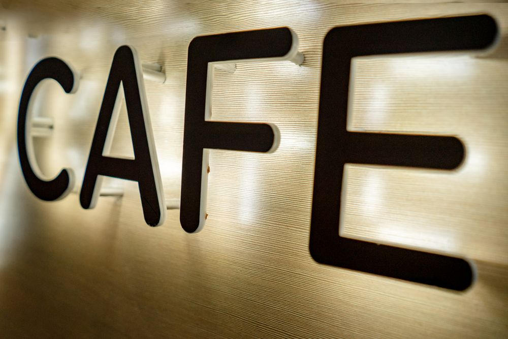 Backlit LED sign board with illuminated letters