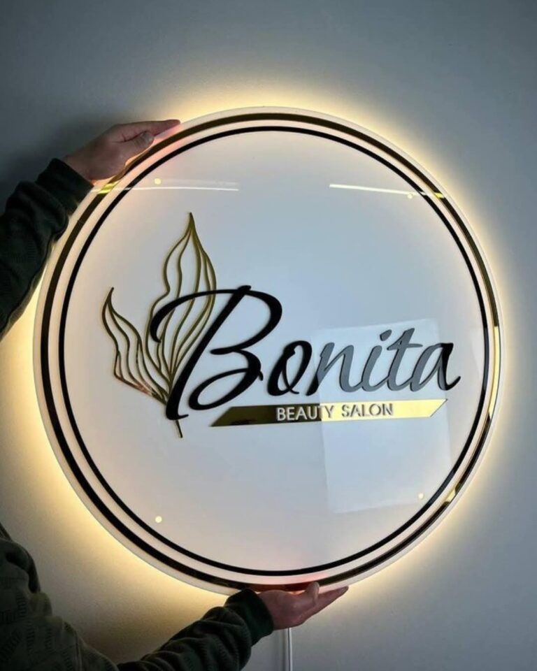 Round backlit 2D acrylic logo board for a beauty salon