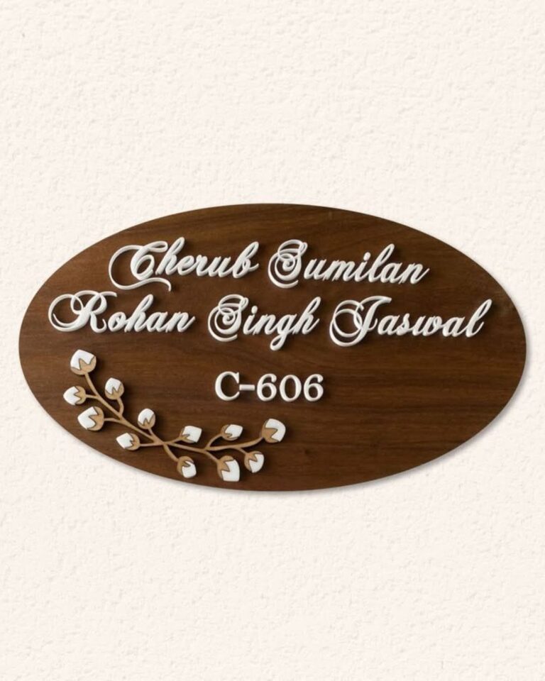 Oval wooden name plate with white raised letters