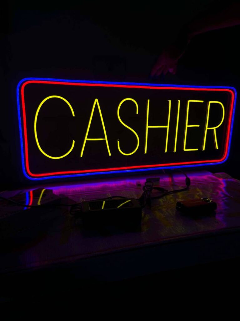 Cashier neon sign in yellow with red and blue border