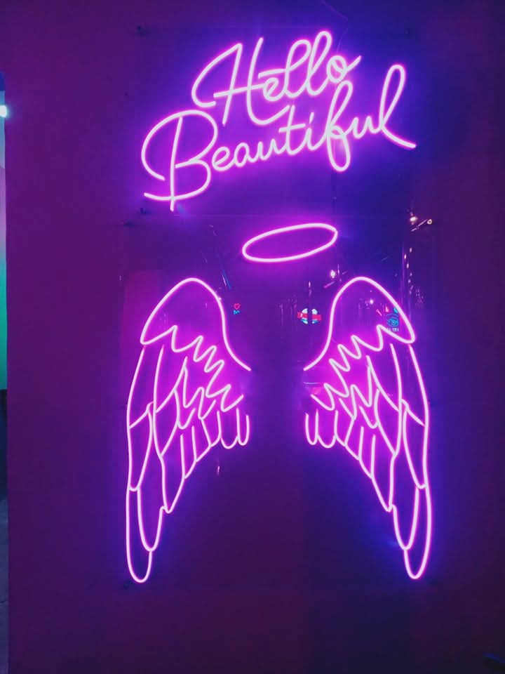 Hello Beautiful neon sign with angel wings and halo in pink