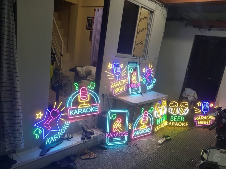 Set of colourful karaoke and beer neon signs made for a bar