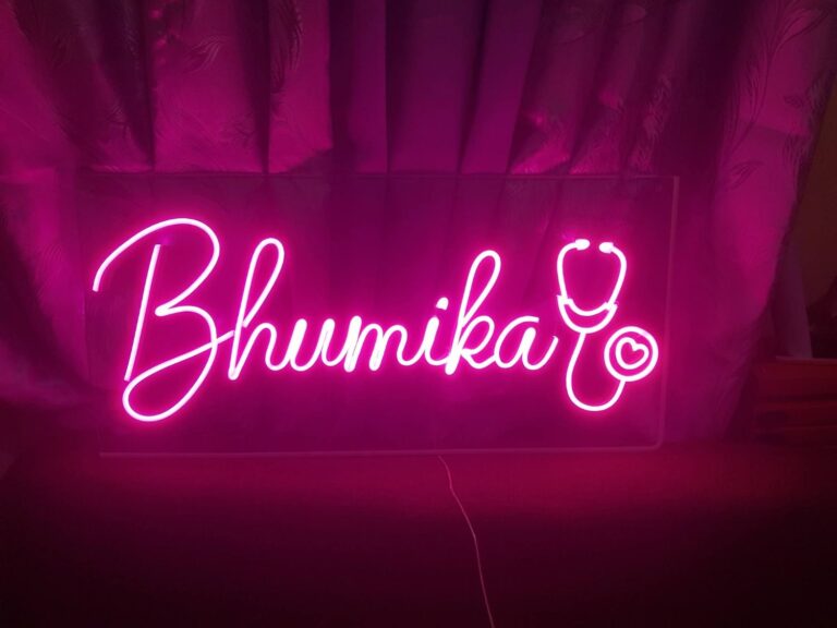 Pink script name neon sign with stethoscope design