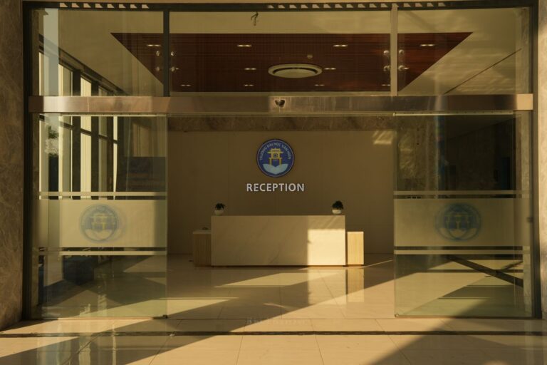 Office reception area with logo signage on the wall